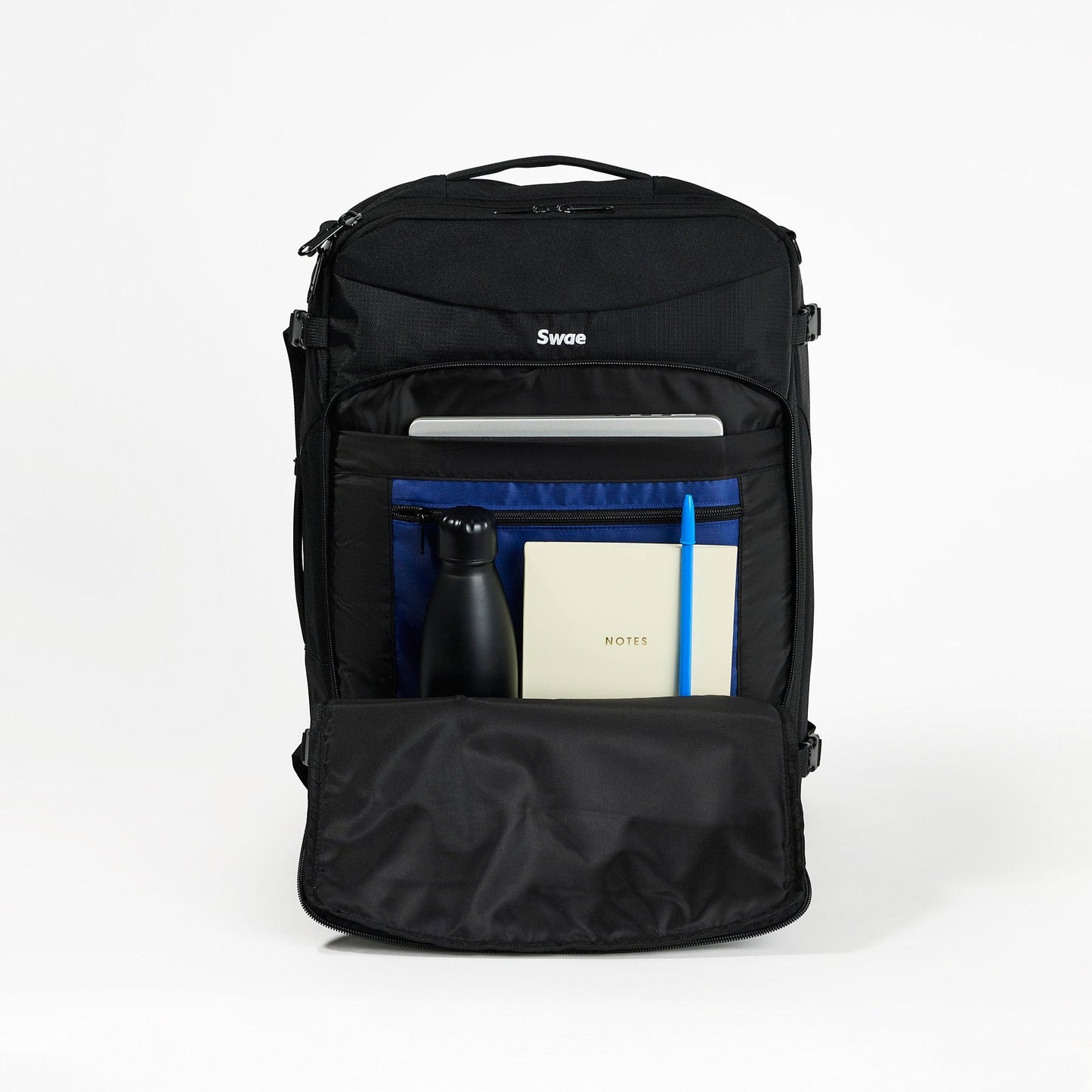 Swae Flow 40L Travel Backpack laptop compartment open – padded sleeve for secure device storage, plus a smaller zip pocket for accessories and cables.
