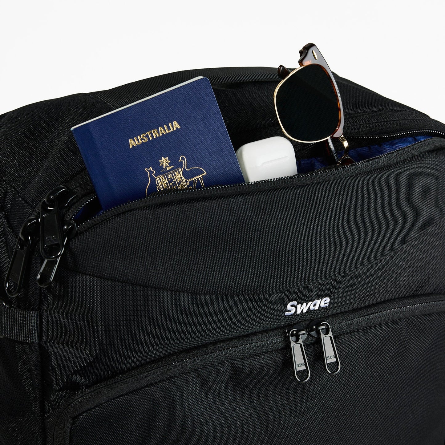 Swae Flow 40L Travel Backpack top quick-access pocket open, ideal for storing passports, wallets, and small essentials while travelling.
