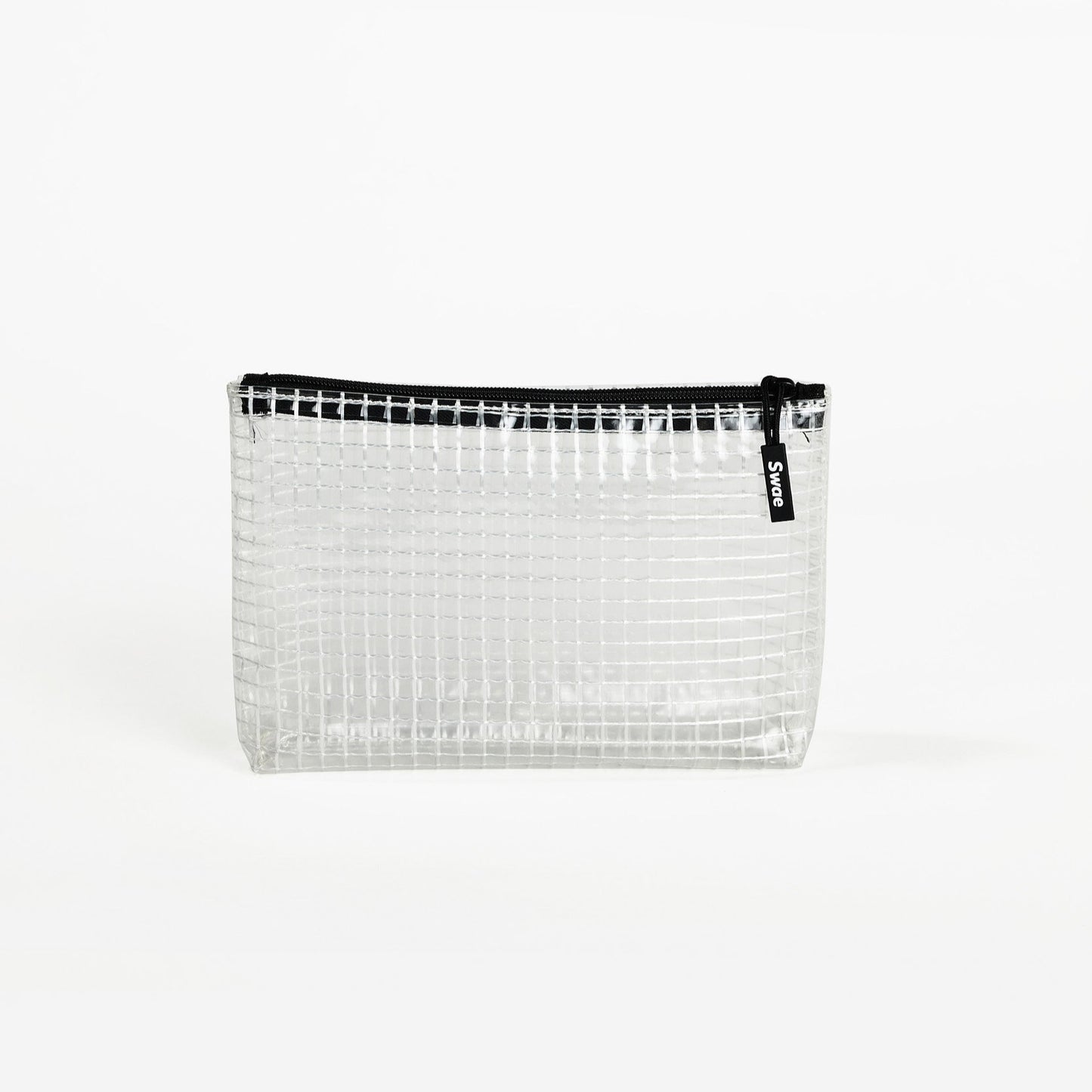 Swae Toiletries Bag – a sleek, tapered travel bag made from transparent coated mesh tarpaulin, designed for easy organisation and quick access to toiletries.