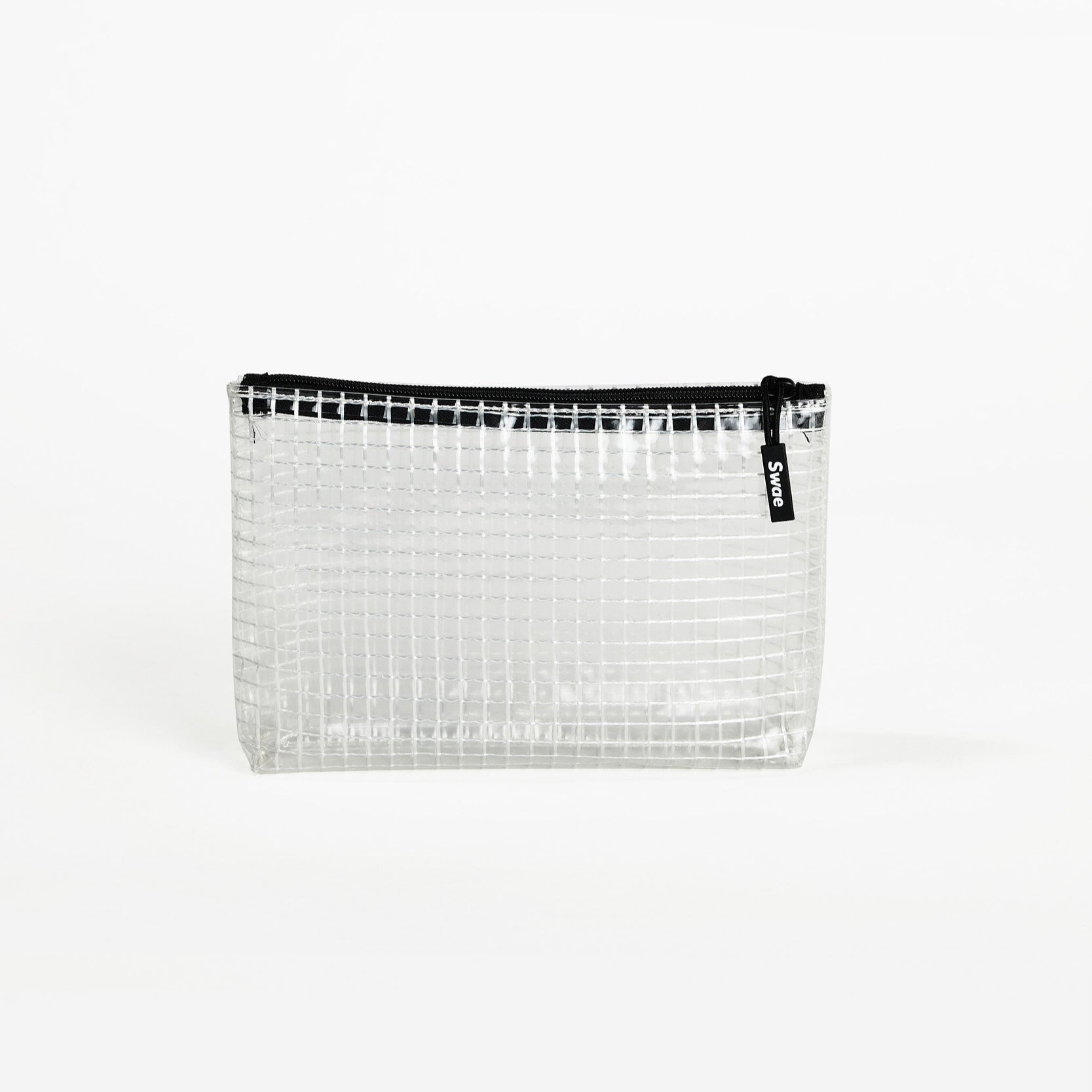 Swae Toiletries Bag – a sleek, tapered travel bag made from transparent coated mesh tarpaulin, designed for easy organisation and quick access to toiletries.